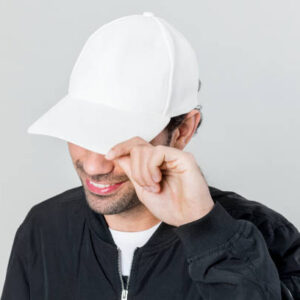 Happy man wearing a white cap